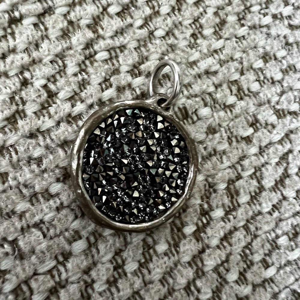 Waxing poetic silver and Swarovski pendant.